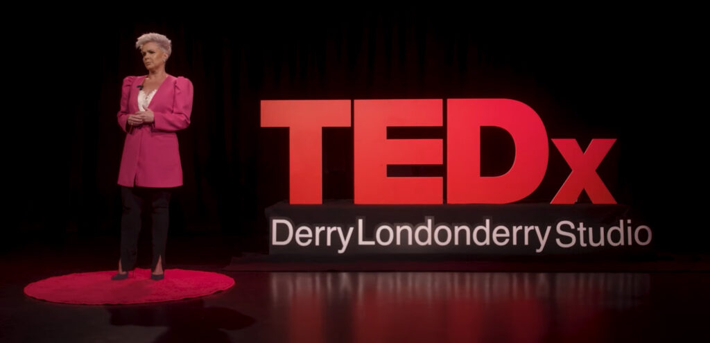 Patricia Breslin delivering TEDx talk in Derry